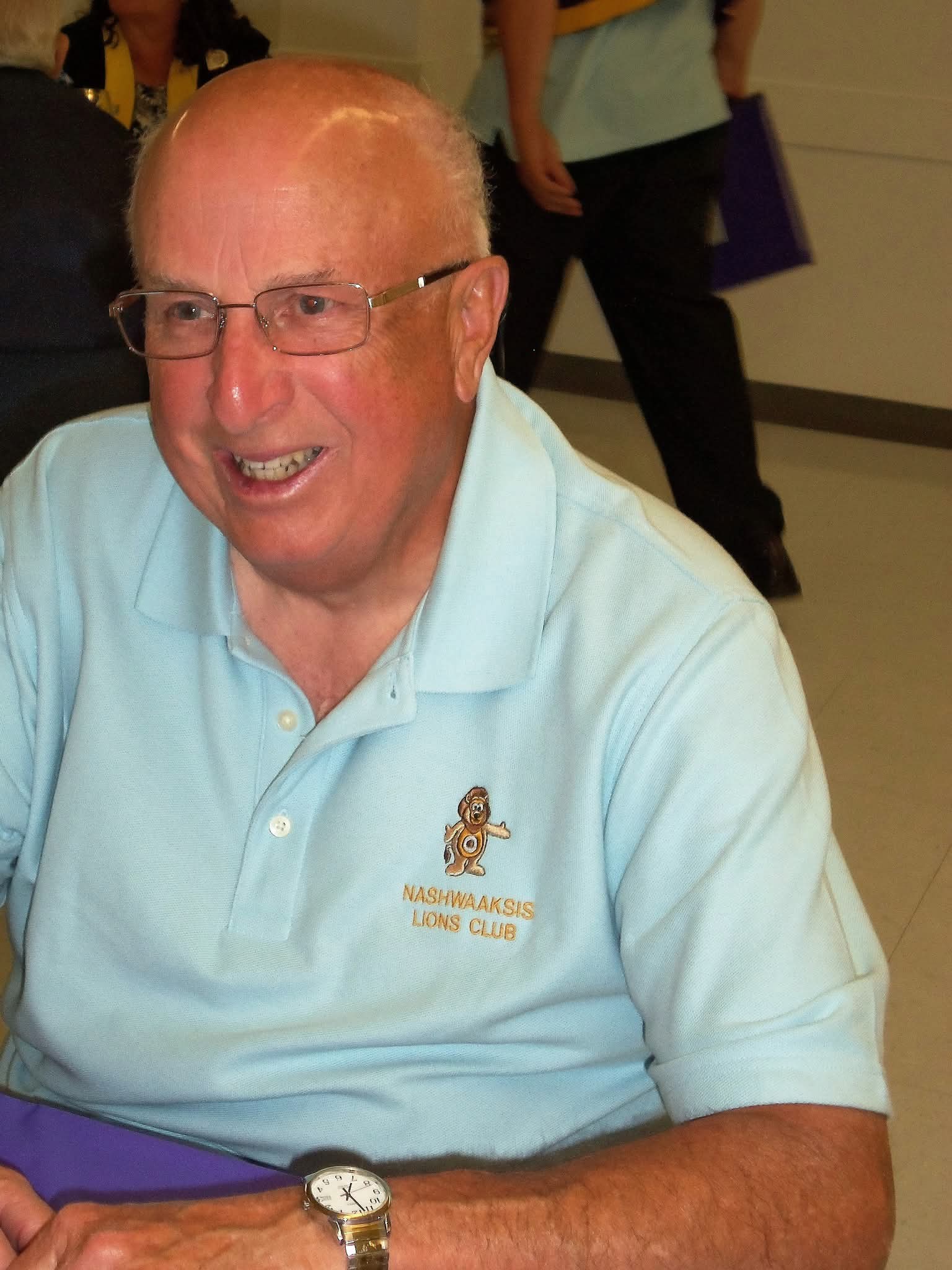 Lion Richard Buchanan wearing a Nashwaaksis Lions Club polo shirt